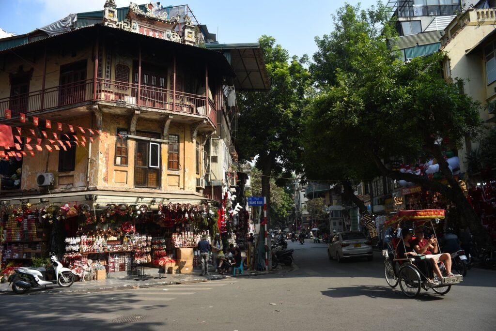 A corner of the Old Quarter in Hanoi with motorbikes and old shophouses
