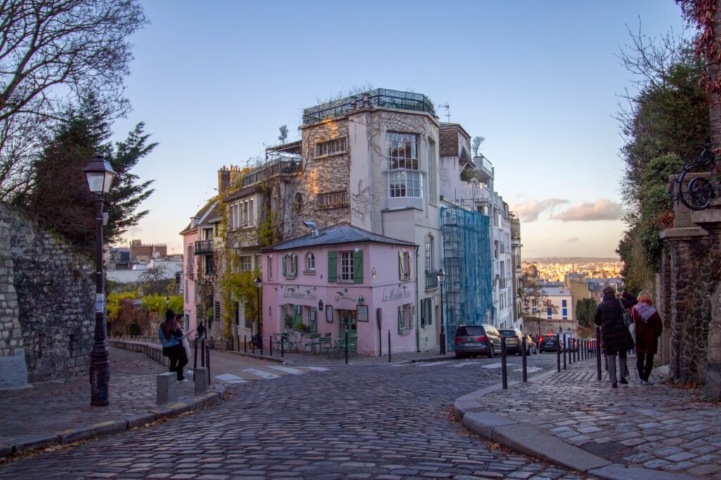 A cobbled street in Montmartre, Paris, at dusk