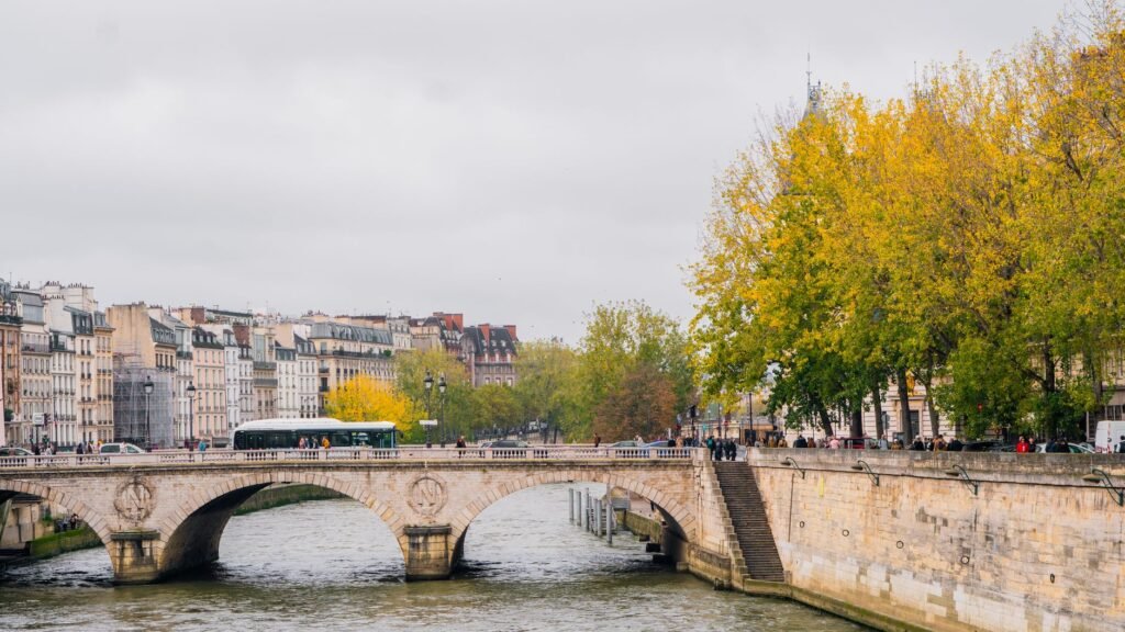 A stone bridge over the Seine in Paris in autumn