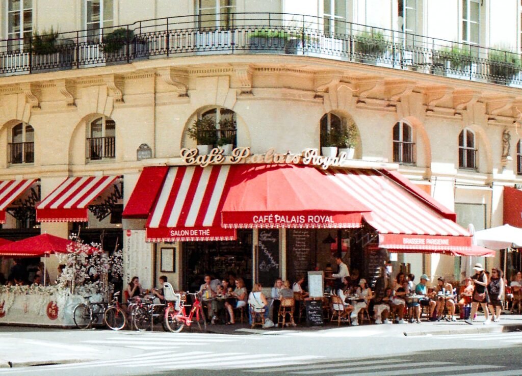 A Paris café terrace with red awnings